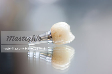 False tooth on reflective background