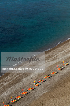 Empty beach chairs on Positano beach, on the Amalfi Peninsula, Campania, Italy