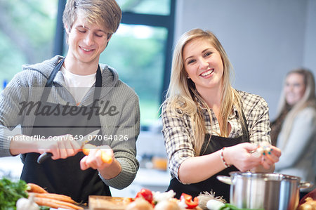 Young couple preparing food