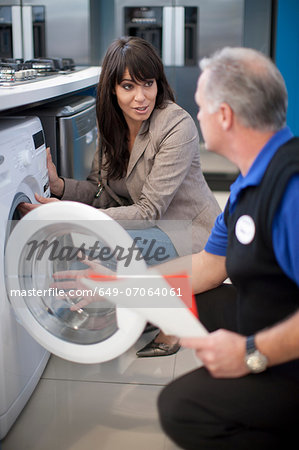 Woman and salesman in showroom