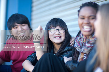 Teenage friends laughing