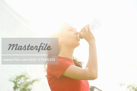 Young woman taking a break from training