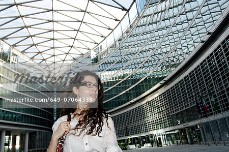 Young businesswoman in modern interior space