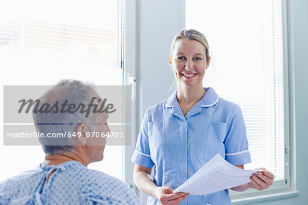 Nurse having conversation with patient