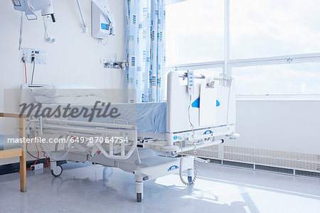 Empty hospital bed on hospital ward Empty hospital bed on hospital ward
