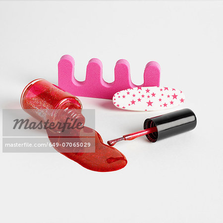 Toe separators and red nail varnish