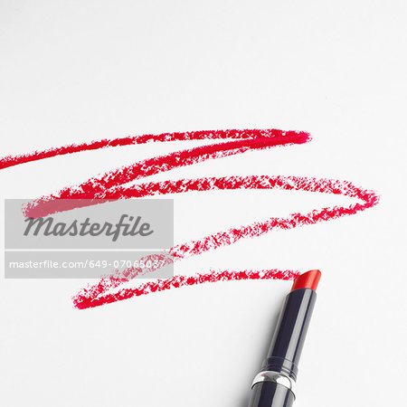 Lipstick zigzag pattern on white background
