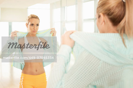 Woman standing in gymnasium