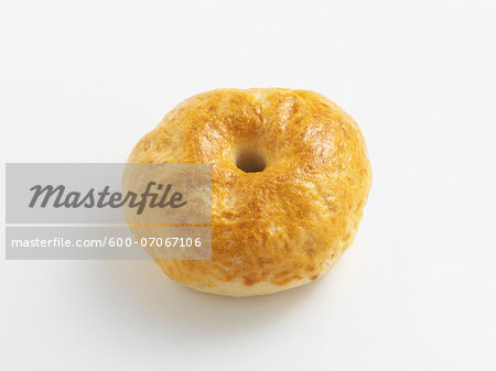 Whole bagel on white background, studio shot