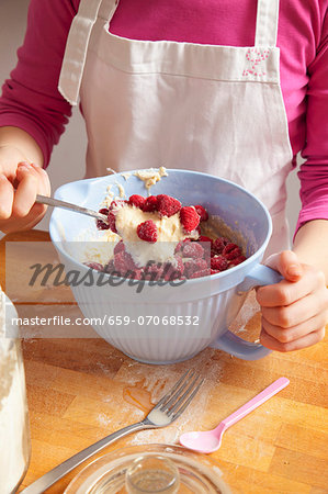 Raspberries being folded into the mixture