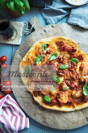 Tomato pizza with fresh basil