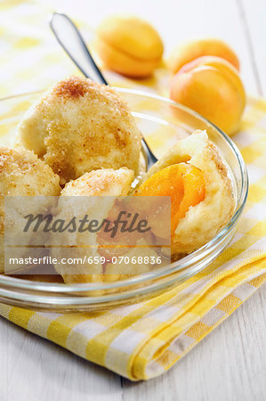 Apricot dumplings with buttery breadcrumb topping and cinnamon sugar