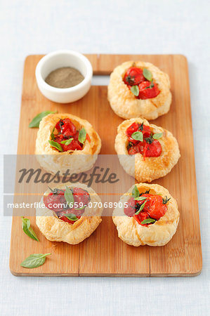 Puff pastry tartlets with cherry tomatoes