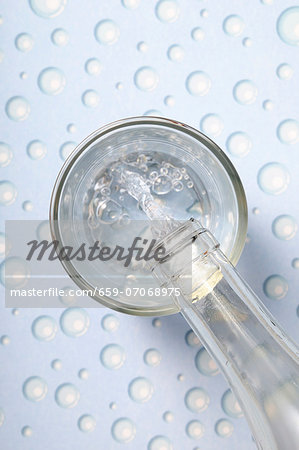 Pouring water into a glass Pouring water into a glass
