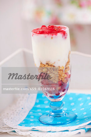 A layered dessert of redcurrants, porridge oats and yoghurt