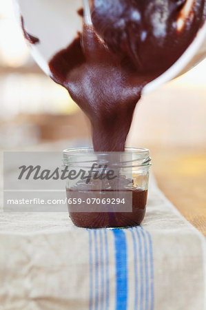 Chocolate & hazelnut spread being poured into a glass
