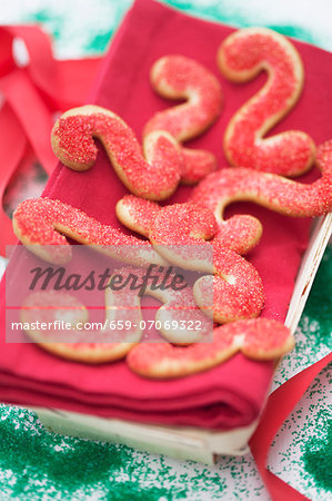 S-shaped butter cookies with red sugar sprinkles
