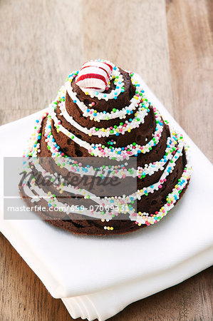 Chocolate cake with pumpkin and ginger; decorated with sugar pearls