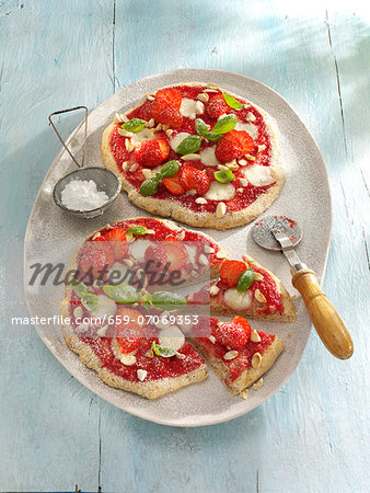 Small strawberry pizzas with basil