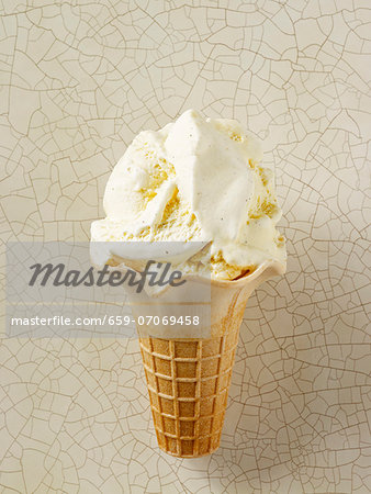Vanilla ice cream in an ice cream cone Vanilla ice cream in an ice cream cone
