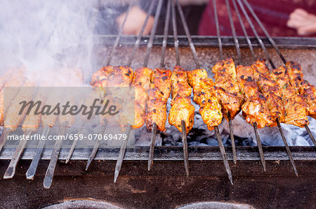 Barbecued skewers of meat at a market in North Africa Barbecued skewers of meat at a market in North Africa