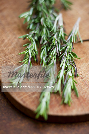 Fresh rosemary on a wooden board