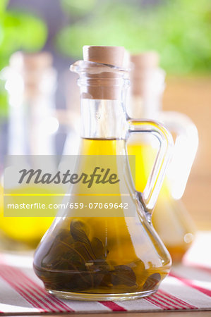 Olive oil with sage in a bottle