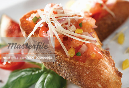 Tomato and pepper bruschetta with parmesan