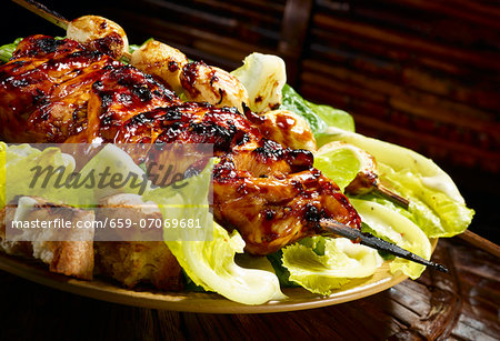 Grilled teriyaki chicken on Caesar salad