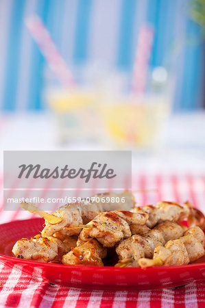 Grilled chicken breast skewers on a plate Grilled chicken breast skewers on a plate