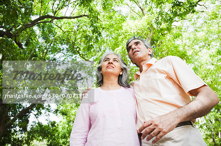 Mature couple standing in a park, Lodi Gardens, New Delhi, India
