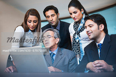Business executives working on a laptop