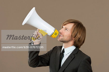 Businessman holding megaphone