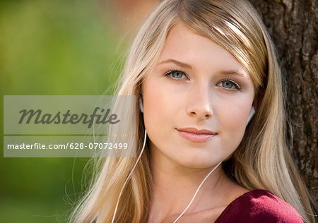 Young woman listening to music outdoors