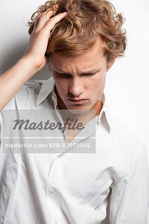 Pensive young man with curly hair