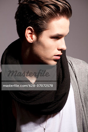 Young man wearing woolen scarf