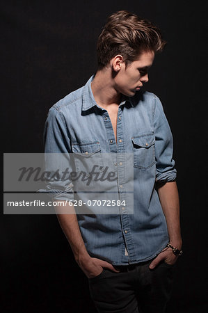 Young man wearing denim shirt