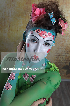 Young woman with traditional Asian body painting, portrait