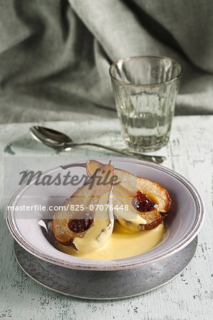 Roast pears with maple syrup ,dried cranberries and cardamom-flavored custard