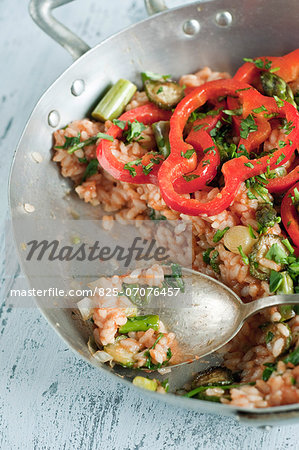 Rice with tomatoes,red peppers,green asparagus and leeks