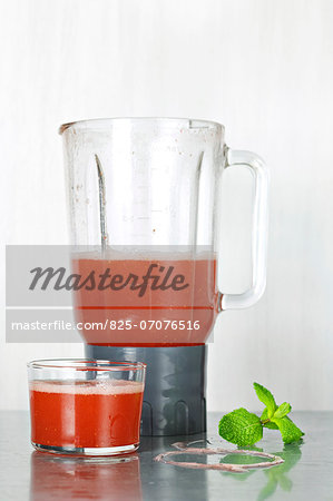 Preparing a strawberry smoothie in a blender Preparing a strawberry smoothie in a blender