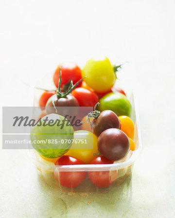 Punnet of multicolored tomatoes