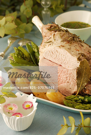 Shoulder of lamb cooked with herbs in a cloth