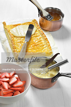 Spreading the confectioner's custard on the cooked flaky pastry