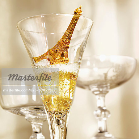 Small Eiffel tower in a glass of Champagne