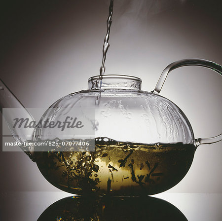 Preparing tea in a glass teapot
