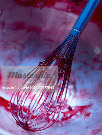 Whisk covered in sugar,fruit pulp and pectin