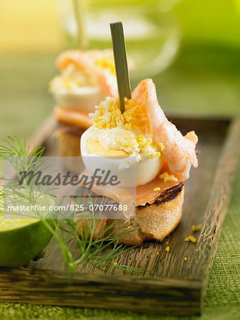 Spanish ham,smoked salmon,shrimp ,egg and mayonnaise crostini