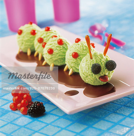Caterpillar-shaped mint ice cream with chocolate sauce