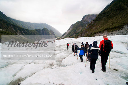 Tourists on Fox Glacier, Westland National Park, UNESCO World Heritage Site, South Island, New Zealand, Pacific